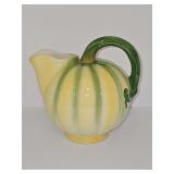 Melon pouring pitcher. 6.5 in tall including handle.