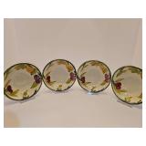 Four Franciscan Fresh Fruit earthenware bowls, hand-painted with a cluster of colorful fruits and a green rim. 6 inch diameter.