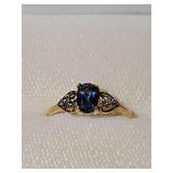 10K yellow gold ring with dark blue and two clear stones. Size 6 1/2 weighing 1.6 g