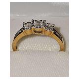 10 karat yellow gold ring with three main clear stones and small chips on each side. Size 8 weighing 2.7 g. Photos do not do this ring justice. It