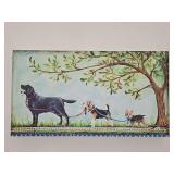 Whimsical print on canvas of a Lab walking a Beagle walking a Yorkie. Stamped on frame ©Kate McRostie. 24x13 in tall.