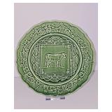 Bordallo Pinheiro green Majolica embossed cow design plate surrounded by pumpkin or squash vines along the scalloped rim. 9.25 in diameter.