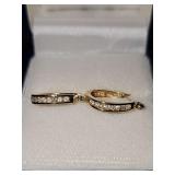14 karat yellow gold pierced earrings with small diamonds. Weighing 2.7 g.