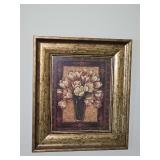 "View From Pompeii II" framed print by Pamela Gladding, featuring a soft bouquet of neutral-toned flowers in a dark vase set inside an ornate gold frame.12.75x14.75 inches tall.