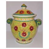 Hand-painted ceramic cookie jar from the Pier 1 Vallarta collection, featuring a vibrant lime-green glazed body adorned with hand-painted red floral motifs and distinct dark-green scrolled side handle