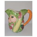 Vegetable pouring pitcher with carrot handle.  7.75 in tall