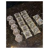 Grouping of clear glass salt cellars and 9 clear glass spoons (one needs repair)