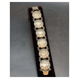 Vintage Sterling coin link bracelet featuring a series of circular medallions stamped with classical profile motifs - 25 grams