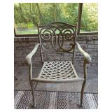 Cast aluminum patio armchair in a light taupe finish with a distinctive scrollwork backrest design and a lattice-woven seat base with Plantation Pattern cushion