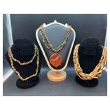 Grouping of (2) chip-beaded necklaces and (1) wood beaded necklace