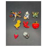 Selection of jeweled and enameled brooches - Apple has peeling