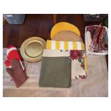 Grouping of oven mitts, placemats, linen napkins