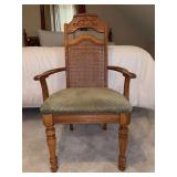 Vintage Neoclassical-style cane-back dining armchair featuring a carved wooden crest and an upholstered patterned seat - 22-1/4 x 17 x 18-1/2 tall to seat (40-1/2 tall overall)