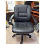 Faux black leather swivel office chair - shows slight wear from normal use