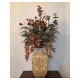 Distressed crackle pattern yellow-beige ceramic vase featuring a faded brown floral urn motif on the front with silk artificial florals - vase is 16” tall
