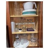 Contents of kitchen cabinet - plastic storage jars, glass s/p shakers and more