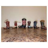 Grouping of (6) heavy resin cowboy boots ornaments - from 3-1/2 to 5-1/4” tall