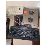 Box of electronic supplies - surge protector, keyboard, numerous cords & chargers