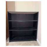 Black 3-tier bookshelf - 29-3/4 x 11-3/4 x 31-1/2 tall - water stain on each back corner