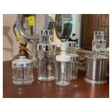 Grouping of (7) various size glass & stainless vanity storage jars