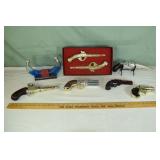 Collection of 8 Avon firearm related cologne bottl