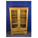 Pine two door over single drawer storage cabinet,