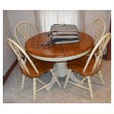 Maple finish round pedestal table and 4 chairs; as