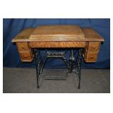 Singer treadle sewing machine with tiger oak cabin