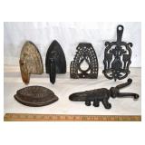 Cast iron lot:  3 sad irons, 2 trivets, boot jack;