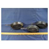 Three 8" cast iron skillets: #8 755B, possibly Wag