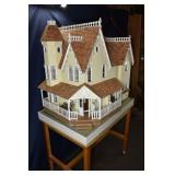 Hand made doll house with accessories on rotating