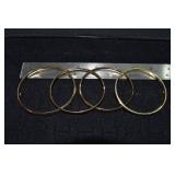 Marked 14 kt gold jewelry: 4 hinged bangle bracele