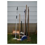 Group of assorted brooms; as is