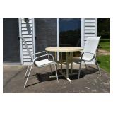 2 aluminum patio chairs and PVC/resin table; as is