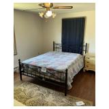 Queen sized bed -metal w/ mattress-quilt
