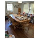 Oak  Oval table w/ 8 chairs- 2 table leaves