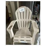 Tan plastic adirondack chair