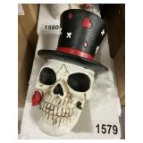 Playing card skull head figure
