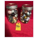 Two Jars Of Marbles