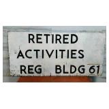 Wood Sign Retired Activities Reg Bldg 61