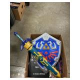 Box Lot With Toy Sword & Shield, Book, Ford
