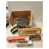 (1) HO Scale Locomotive, (3) Train Cars, (1)