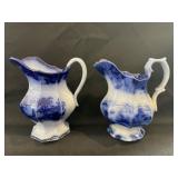 2 Flow Blue Creamers, both with damage or repair