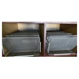 2 metal paper filing racks with file folders