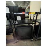 black rolling metal cart and tv