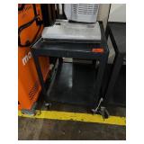 small black metal rolling cart