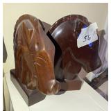 Two wooden horse heads
