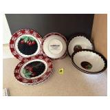 black and red plates and bowls with cherries