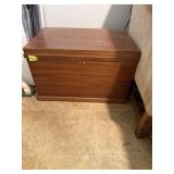 Brown wood chest lined with lid