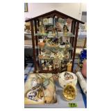 Glass carrier display case with a collection of